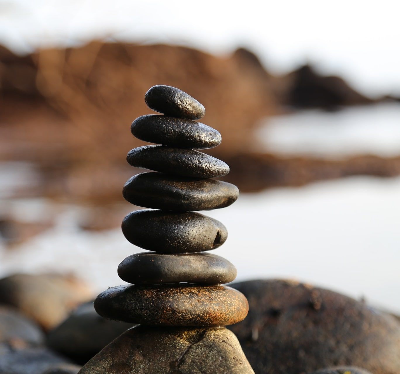 Rocks balanced by a pebble beach